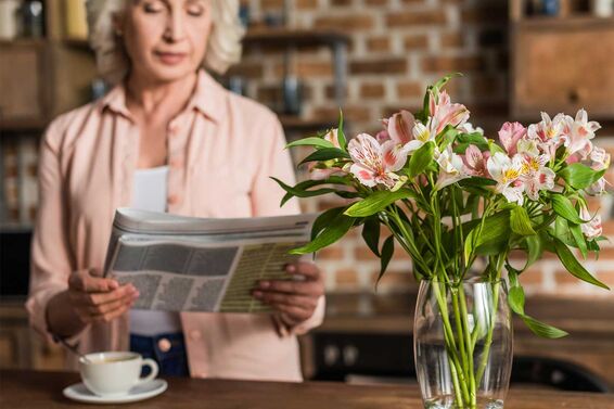 woman reading obituary